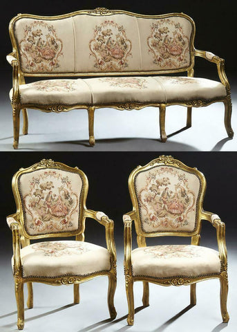A Louis XV style gilt wood sofa and armchair
